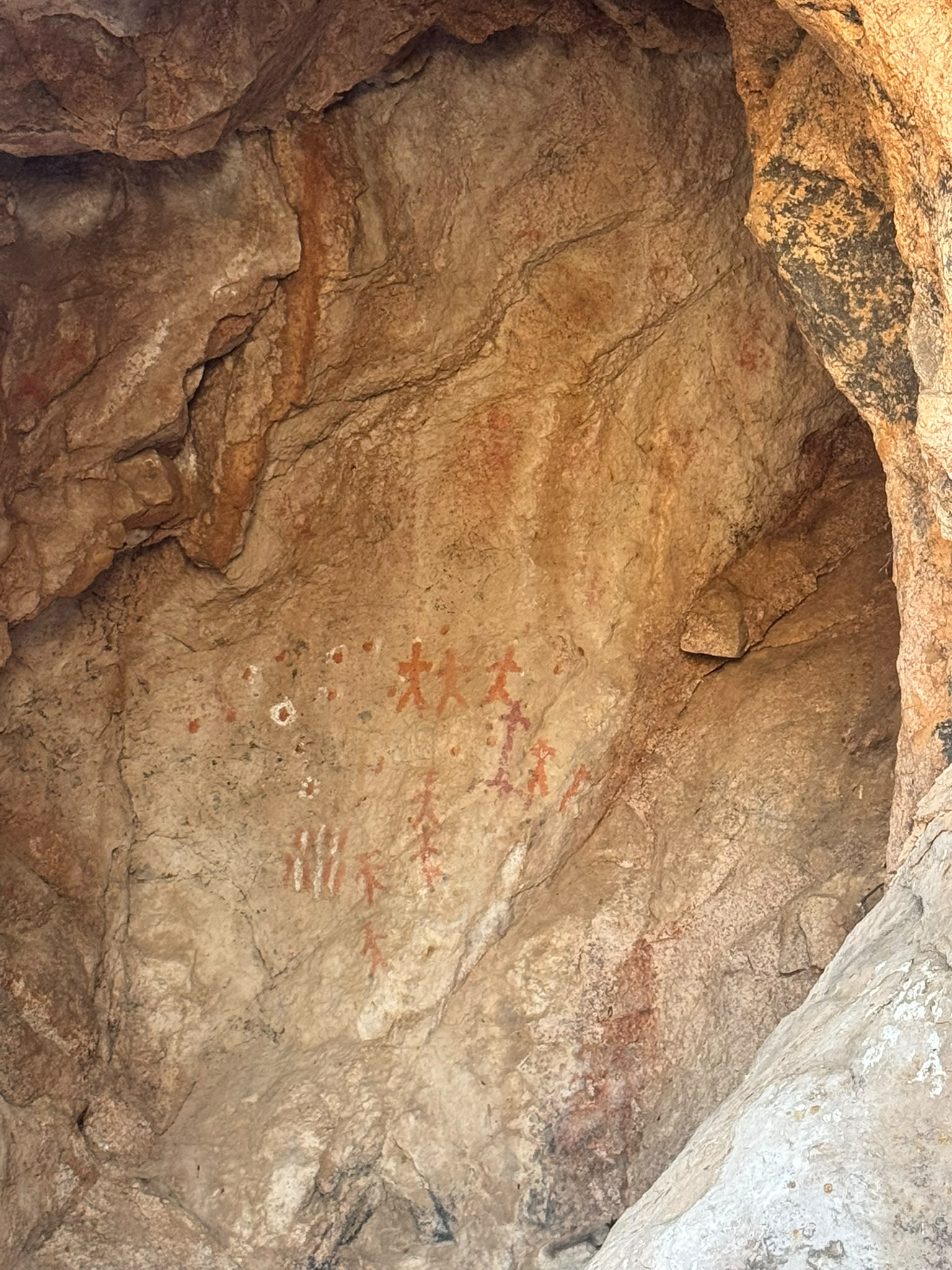Ancient Comcaac pictographs of human figures painted on the wall of the sacred cave