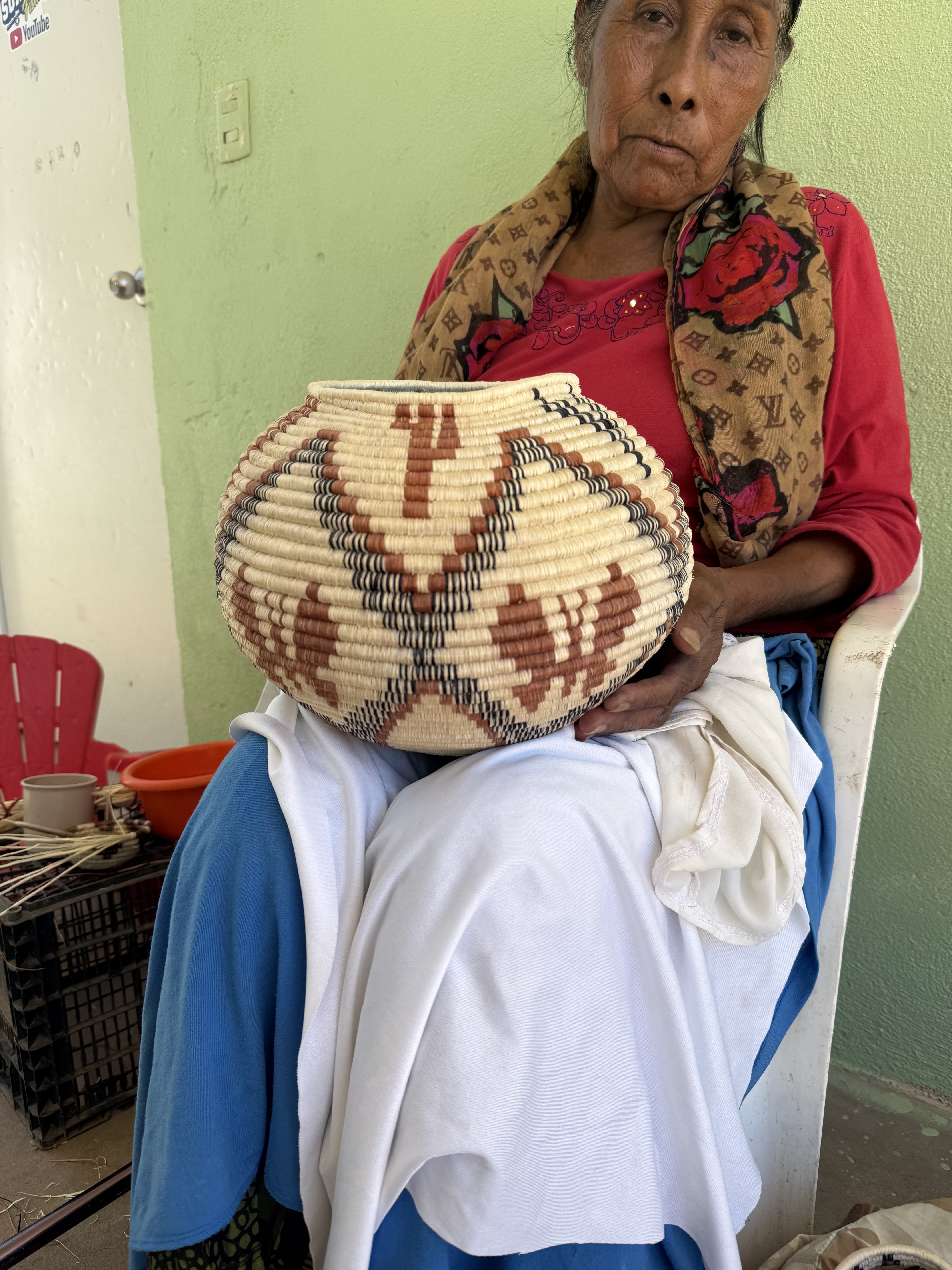 A Comcaac elder with a hand-woven basket
