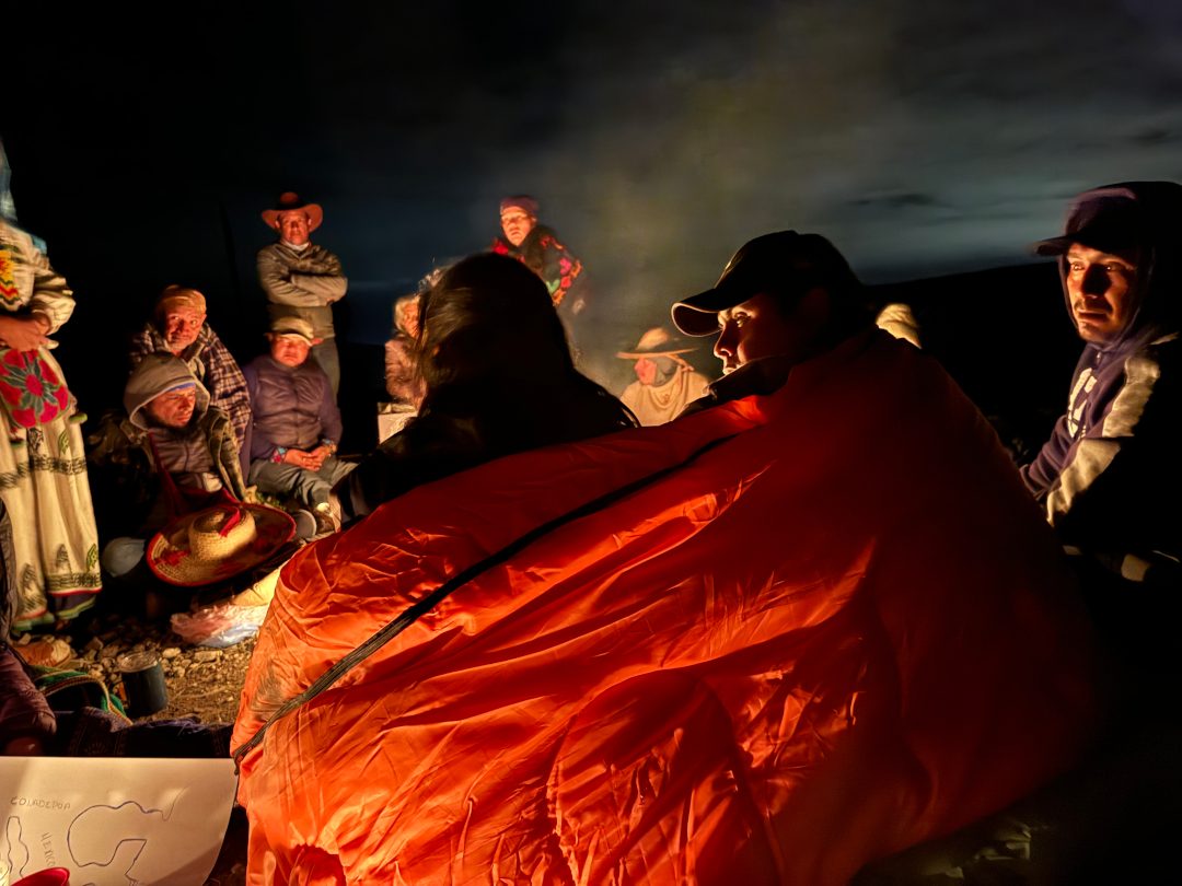 Community gathered around the ceremonial fire